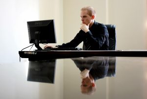 Business, businessman, chair — IRA Gold Custodians Delivering Personalized Service and Secure Options for Precious Metal Inve