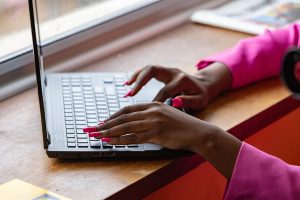 Laptop, typing, working — Selling insurance agency with focus on client retention, operational transition, and maximizing val